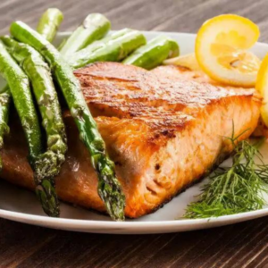 Eating healthy doesn't mean you have to sacrifice the foods you love. Follow us for the Heart Healthy Recipe for Baked Salmon With Asparagus and Lemon Garlic