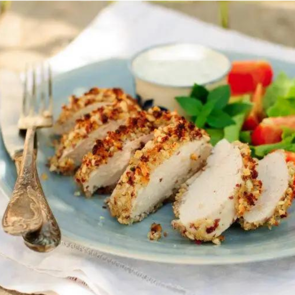 Eating healthy doesn't mean giving up the foods you love. Follow us for a heart healthy recipe for pepita-crusted chicken cutlet salad!