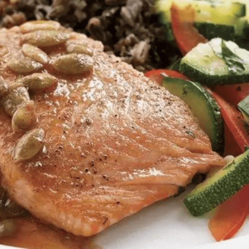 Learn how to make Salmon with Pepita-Lime Sauce and delight your taste buds with this flavorful and healthy dish.